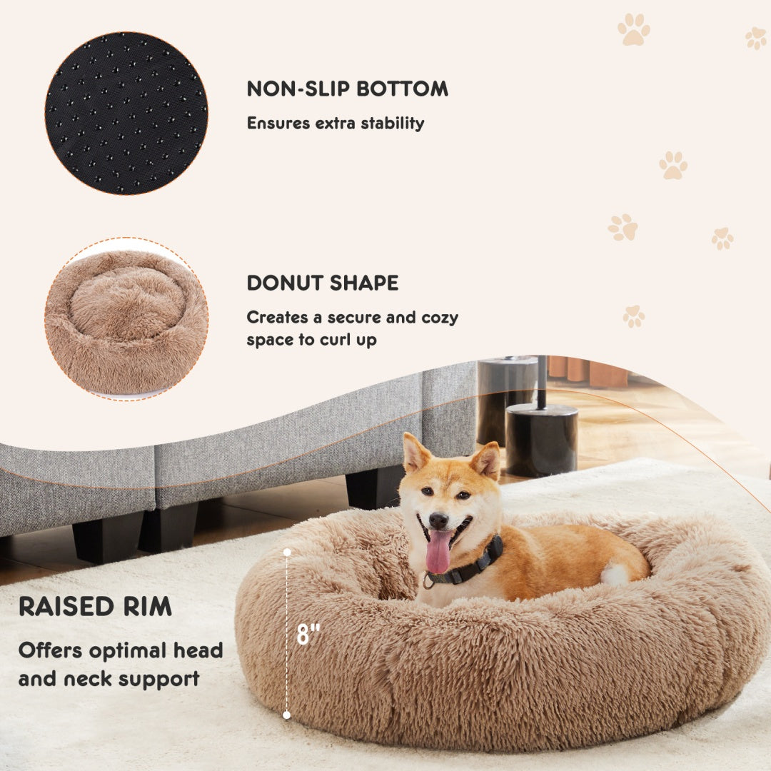 Dog lying on a donut-shaped pet bed with features highlighted on a white background.
