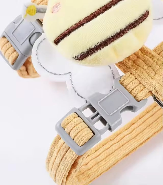 Dog collar with a plush toy attached on a white background