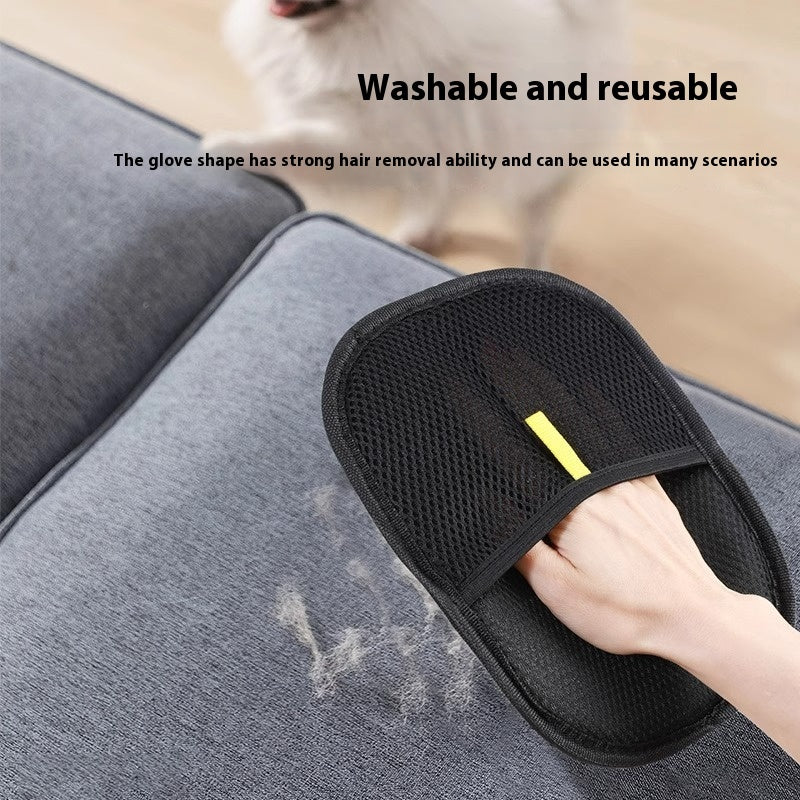 A black mesh pet grooming glove being used on a gray sofa to remove loose fur, with a human hand visible and English text reading 'Washable and reusable' and a descriptive feature callout.