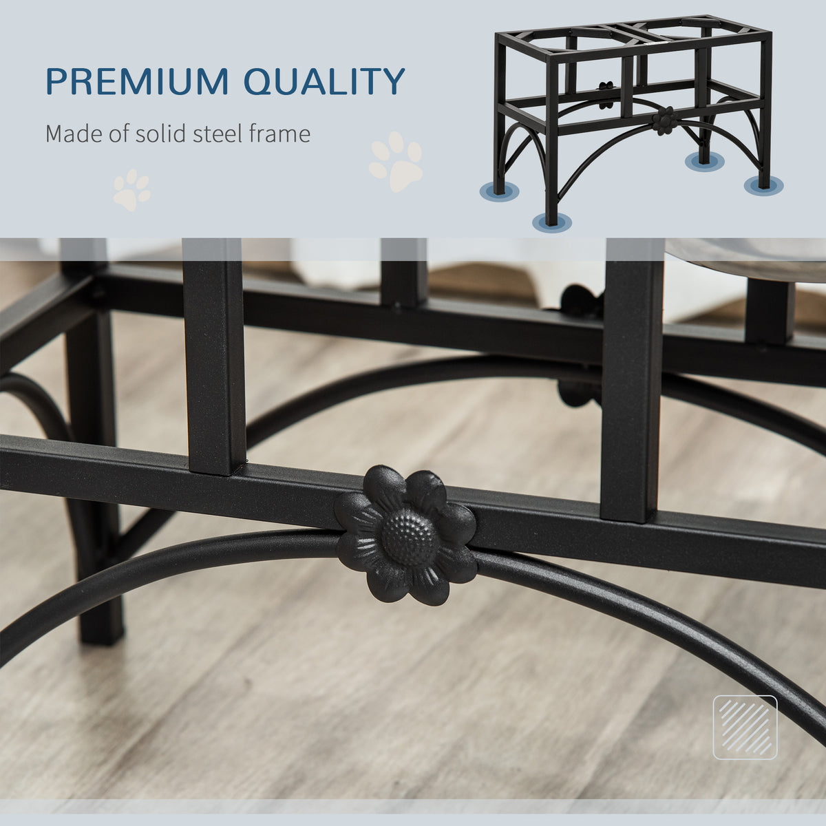 Close-up of a black metal table base with decorative elements on a wooden floor.