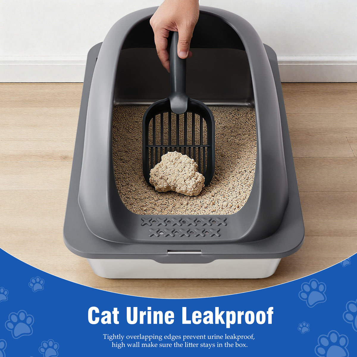 Cat litter box with scoop and cat litter on a wooden floor, featuring text about urine leakproof design.