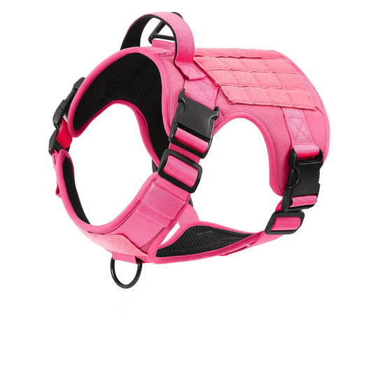 A pink tactical dog harness with black mesh padding and black plastic quick-release buckles, shown on a solid white background.