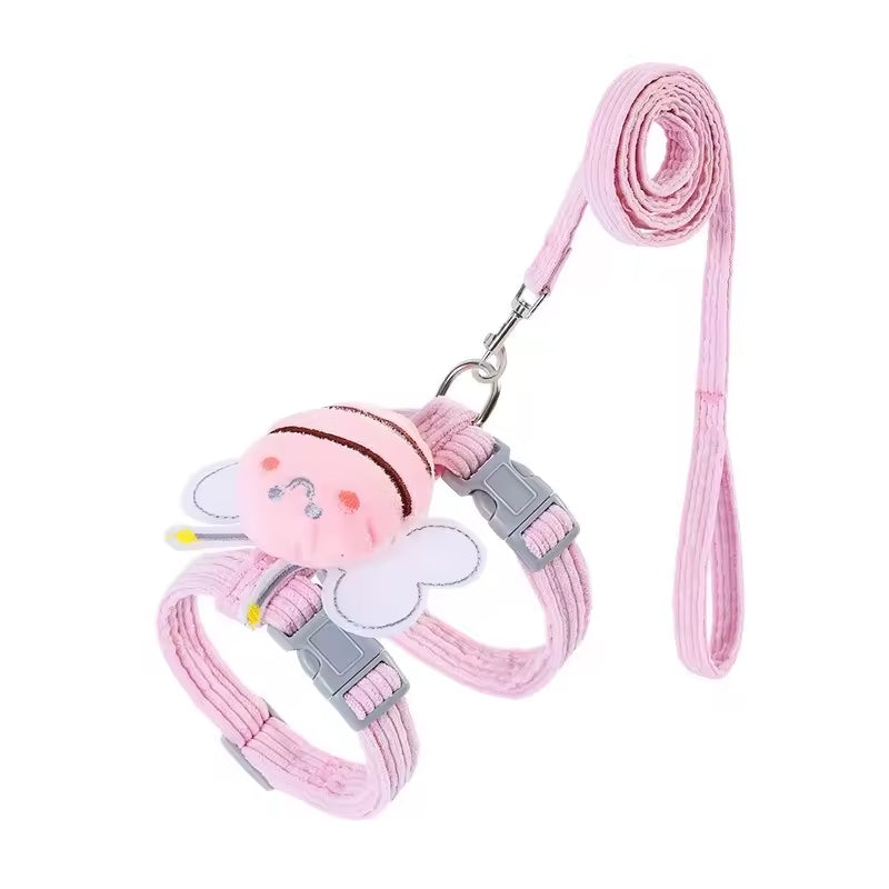 Pink dog leash with a cartoon character attachment on a white background