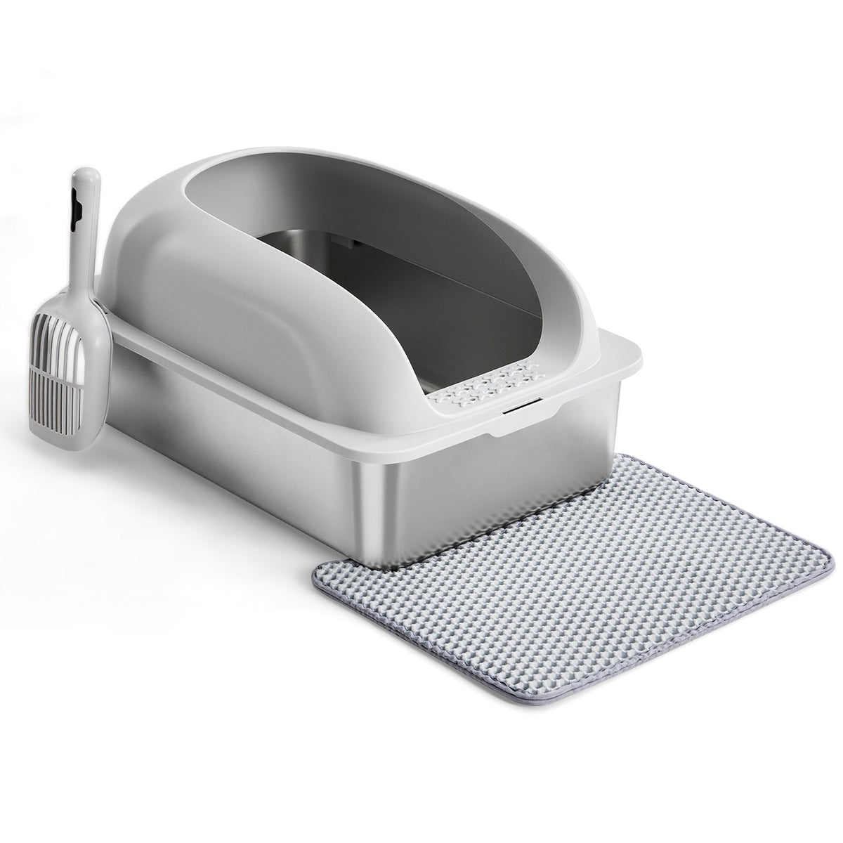 Cat litter box with scoop and mat on a white background