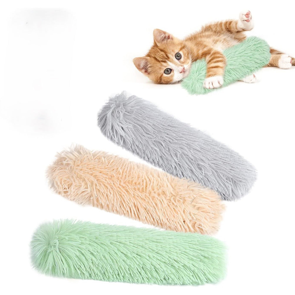 Cat lying on a green fluffy mat with additional mats in gray, beige, and green displayed below.