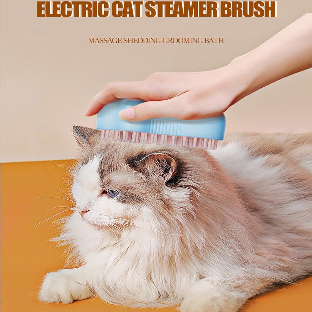 A fluffy long-haired cat lies on an orange surface while a human hand uses a blue electric cat steamer grooming brush on its back. Text at the top reads 'ELECTRIC CAT STEAMER BRUSH' and 'MASSAGE SHEDDING GROOMING BATH'.