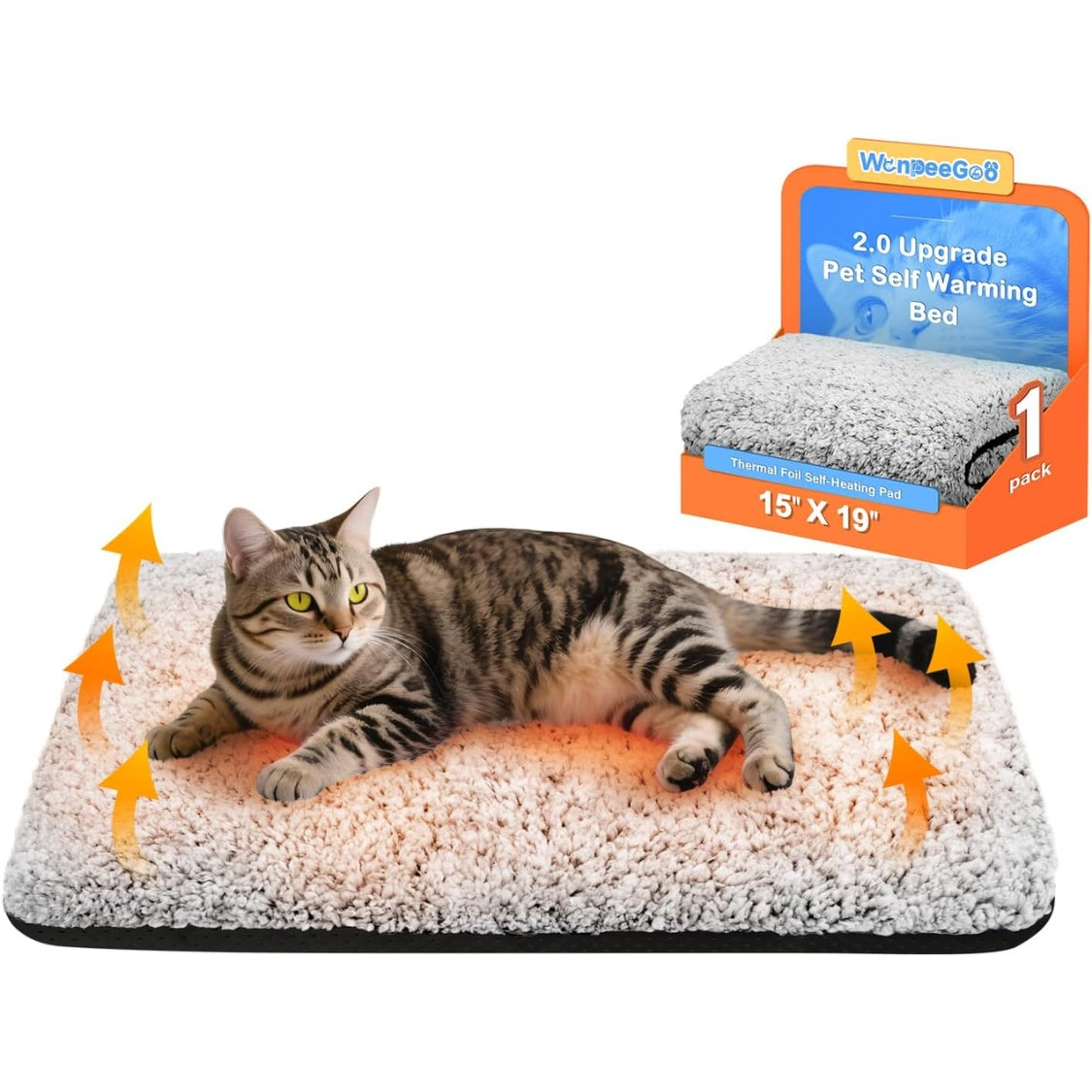 Cat lying on a pet warming bed with product packaging in the corner